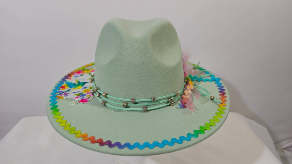Arcadian Flight — mint green wide-brim hat with hummingbird artwork and rainbow trim