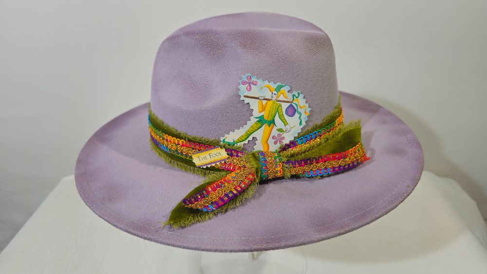 The Fool's Journey — lavender tarot hat with jewel-toned braided trim