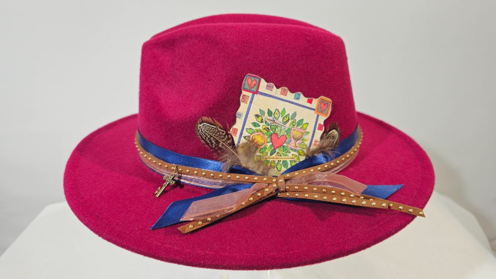 Fortune Keeper — burgundy tarot hat with feathers and gold-toned detailing