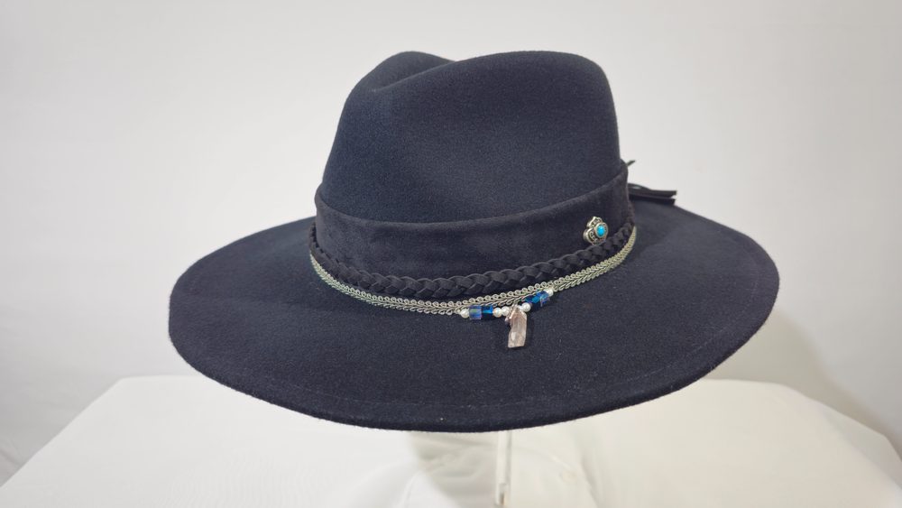 Midnight Talisman — black wide-brim hat with a crystal point and turquoise accent